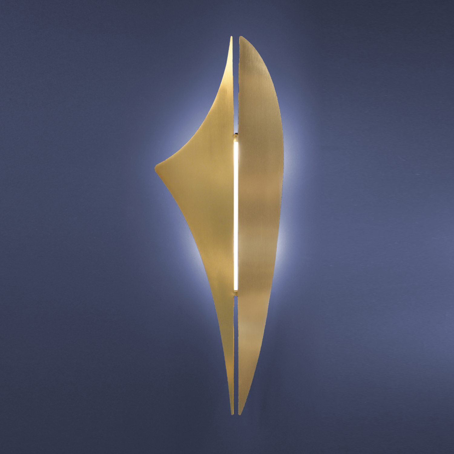 REY wall light in brushed brass on blue background